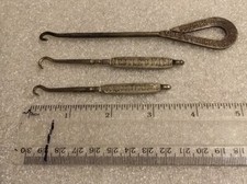 Three Vintage Advertising Boot/Glove Hooks 