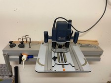 Woodrat woodworking tool with Bosch router and collection of accessories
