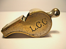 A VINTAGE THE ACME THUNDERER , HUDSON'S PATENT BRASS , L.C.C. WHISTLE .