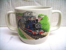 A VINTAGE Wedgwood, Thomas The Tank Engine double handled mug for a young child.