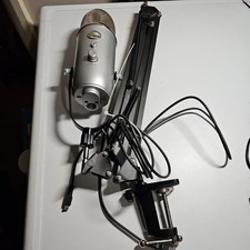Blue Yeti USB Microphone Silver On Desktop Arm
