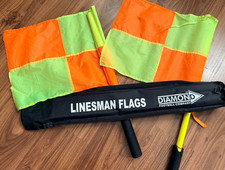Football linesman flags by