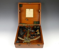 An early 20th century brass sextant by Hughes & Son