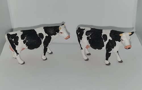 Two siku friesian cow figures - two,