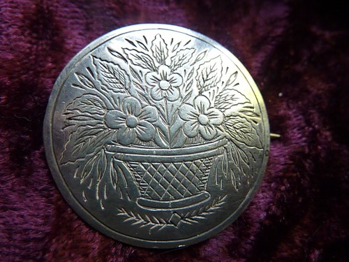 Vintage embossed silver brooch