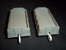TWO GREY TOMY FLAT BED TRUCKS