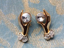 gold tone hand holding