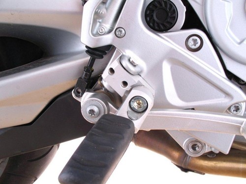 Footrest lowering driver