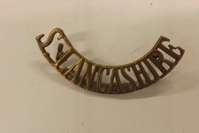 MILITARY SHOULDER TITLE BADGE