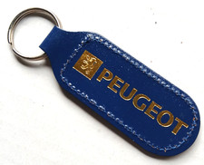 PEUGEOT GOLD FOIL PRINTED BLUE LEATHER ENGLISH KEYRING ALEXANDERS TWICKENHAM