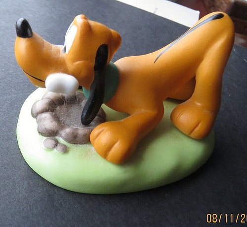 Pluto figurine one a - pluto,