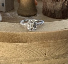 Engagement ring, platinum with 0.3 carat emerald cut. GIA Certificate