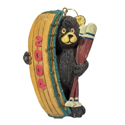 Black bear with canoe and - black, oars