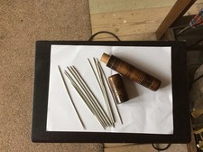 vintage wooden needle holder and needles