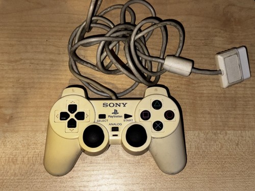 Official dual shock - (yellowed),