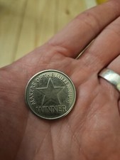 makers of the millennium coin