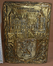 Brass relief with coat of