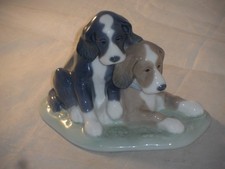 NAO BY LLADRO POTTERY TWO TIRED PUPPIES FIGURE MODEL 1046. 12cm High x 15cm Wide