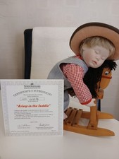 Porcelain Cowboy Doll on Rocking Horse