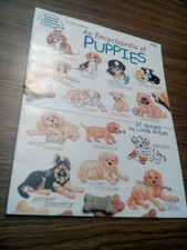 American school of needlework puppies cross stitch  offers welcome