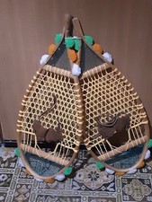 A Pair Of  Wooden Snowshoes With Lattice Webbing And Rawhide Leather Bindings