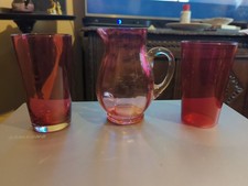 Two Antique 19th Century Cranberry Glass Tumblers And A Cranberry Glass Jug