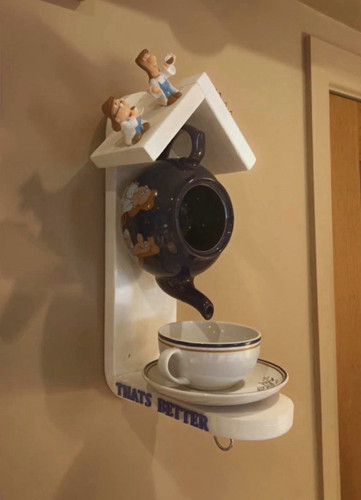 Tetley teapot and mug bird