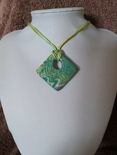 Pendant in yellow and green a one of item that will look great with any outfit