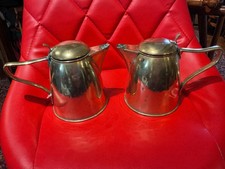 A Pair Brass  lidded Jugs Christopher Dresser  style