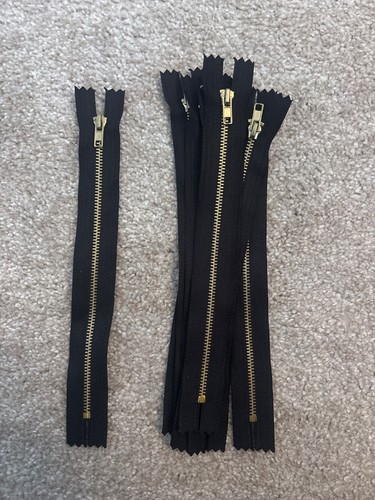 Black zipper gold teeth - gold,