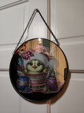 Etched and coloured image on