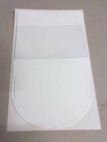 White shield shaped tax - tax, disc