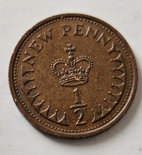 1973 half new penny coin - half,