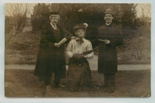 POSTCARD Fancy dress policeman, graduate, man dressed as woman, RPPC