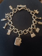 Authentic Swiss Made - Burberry Lady Sterling Silver Charm Bracelet Watch BU5200