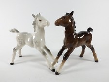 TWO BESWICK FIGURINES OF FOALS STANDING ONE BAY OTHER GREY NOS 836 REF 1140/12