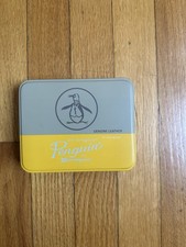 An Original Penguin ~By Munsingwear Empty Tin Box Yellow/Gray Color New”. B13