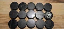 15 Black Hockey Pucks