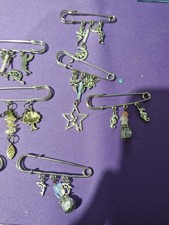 charm broaches job lot - hand