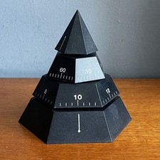 Moving Time Pyramid Black Plastic Clock