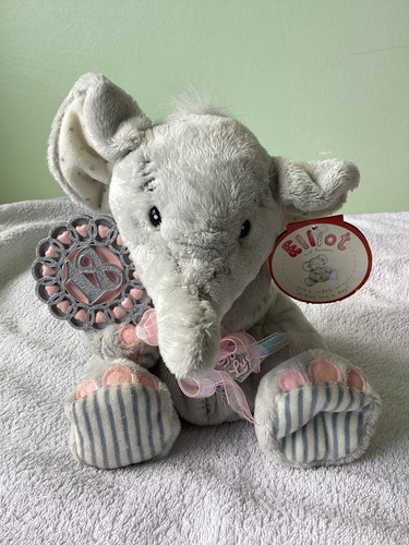 Elliot buttons elephant with - &,