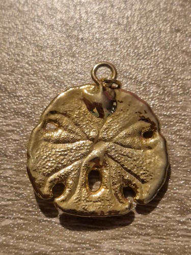 Gold tone sand dollar sea - sand,