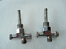 Dual plunger motorcycle petrol taps.