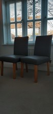 Two Grey Faux Leather Dining