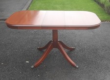 extending dining table made by