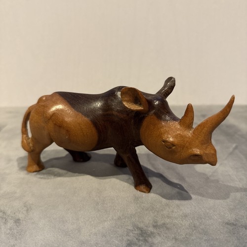 Hand carved wooden rhino - hand,