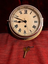Antique brass ships clock with original keys.