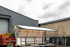 20ft converted retail/display container. Powered drop down side & Custom Railing