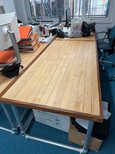 Quirky office desks made from maple flooring and scaffolding poles