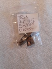 TRIX PICK UPS, SHOES,  BRASS PLATE.ETC. 4 PARTS. LOT 3 FOR SPARES